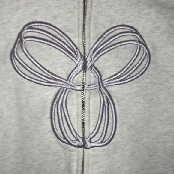 Very light grey TNA zip up with light purple logo - Picture 2 of 11